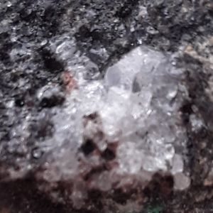 Raw diamond in matrix with malachite crystals